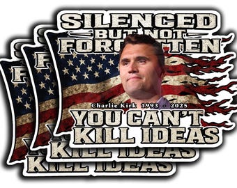 May include: A stack of stickers featuring an image of Charlie Kirk with the American flag as a backdrop. Text includes "SILENCED BUT NOT FORGOTTEN" and "YOU CAN'T KILL IDEAS". The stickers have a white border.