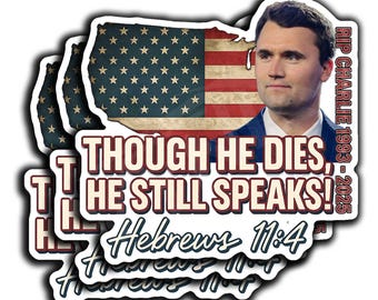 May include: A stack of stickers featuring a portrait of a man, the American flag, and text. The text reads "Though He Dies, He Still Speaks! Hebrews 11:4" and "RIP Charlie 1993-2025". The flag is in the shape of the United States.