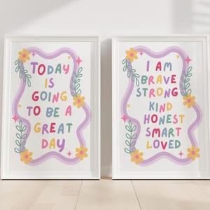 May include: Two framed art prints with inspirational quotes. The left print reads "TODAY IS GOING TO BE A GREAT DAY" in colorful text. The right print says "I AM BRAVE STRONG KIND HONEST SMART LOVED". Both have floral and star accents.