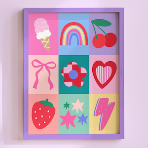 May include: A framed wall art print featuring a grid of nine colorful illustrations including an ice cream cone, a rainbow, cherries, a pink bow, a checkered flower, a heart, a strawberry, various stars, and a pink lightning bolt.