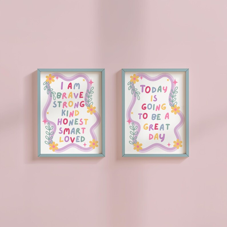 May include: Two framed art prints with inspirational messages. One print reads "I AM BRAVE STRONG KIND HONEST SMART LOVED" in colorful text. The other says "TODAY IS GOING TO BE A GREAT DAY". Both have floral and wavy design elements.