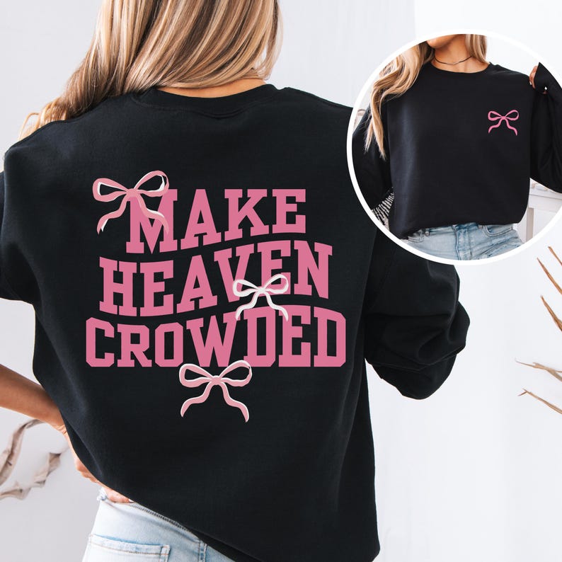 May include: Black sweatshirt with pink text that reads "Make Heaven Crowded" and pink bows.