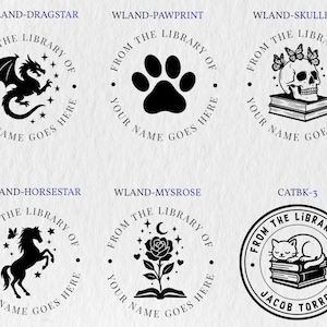 May include: Six circular black ink stamps featuring book-themed designs. Icons include a dragon, paw print, skull with butterflies on books, horse, rose on an open book, and a cat sleeping on books. Each stamp includes the text FROM THE LIBRARY OF.