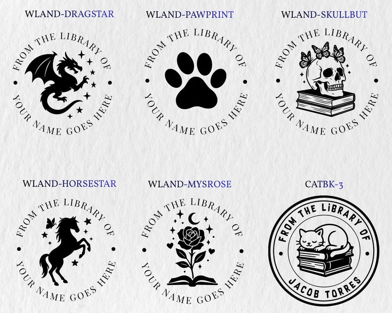May include: Six circular black ink stamps featuring book-themed designs. Icons include a dragon, paw print, skull with butterflies on books, horse, rose on an open book, and a cat sleeping on books. Each stamp includes the text FROM THE LIBRARY OF.