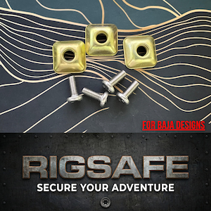 May include: Three gold-coloured square metal pieces with a central hole, and four silver screws. The text "FOR BAJA DESIGNS" is in red. The bottom of the image has the text "RIGSAFE SECURE YOUR ADVENTURE".
