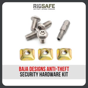 May include: A Baja Designs anti-theft security hardware kit featuring three silver-coloured metal bolts with star-shaped security heads, one matching star-shaped driver bit, and three square-shaped gold-coloured metal nuts with threaded centres.
