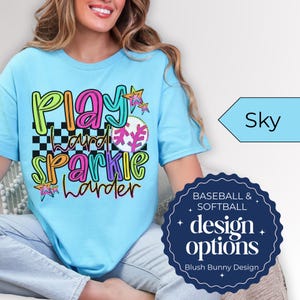 Get ready for game day with our Play Hard Sparkle Harder Softball Baseball Shirt! This Gildan Unisex Tee is perfect for Softball Moms who want to shine bright while cheering on their team. Featuring a dazzling glitter design, this shirt combines comfort and style effortlessly. Whether you're in the stands or on the field, this shirt is sure to turn heads. Show your support with a touch of sparkle! 🌟 Grab yours today and elevate your gameday look!
