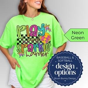 Show off your love for the game with our Play Hard Sparkle Harder Softball Baseball Shirt! This Gildan unisex tee is perfect for softball moms and game day enthusiasts alike. Featuring a stylish glitter design, it's a fun way to stand out in the stands. Made from soft, high-quality fabric, this shirt ensures comfort while you cheer on your favorite player. Get ready to sparkle and shine on and off the field! Perfect for gifts or your own collection. Available in various sizes.