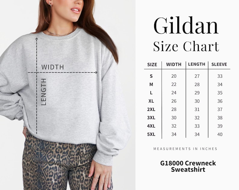 May include: A light gray Gildan G18000 crewneck sweatshirt. The image includes a size chart with measurements in inches for sizes S to 5XL. The chart shows the width, length, and sleeve measurements for each size. The model is wearing the sweatshirt.