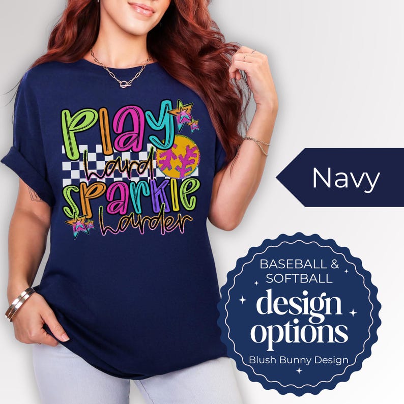 Get ready for game day with our Play Hard Sparkle Harder Softball Baseball Shirt! This Gildan Unisex Tee is perfect for Softball Moms who want to shine bright while cheering on their team. Featuring a dazzling glitter design, this shirt combines comfort and style effortlessly. Whether you're in the stands or on the field, this shirt is sure to turn heads. Show your support with a touch of sparkle! 🌟 Grab yours today and elevate your gameday look!