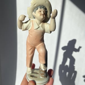 Vintage ceramic figurine of a boy, made in Japan