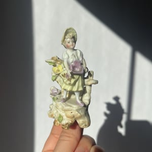 Antique mini porcelain figurine