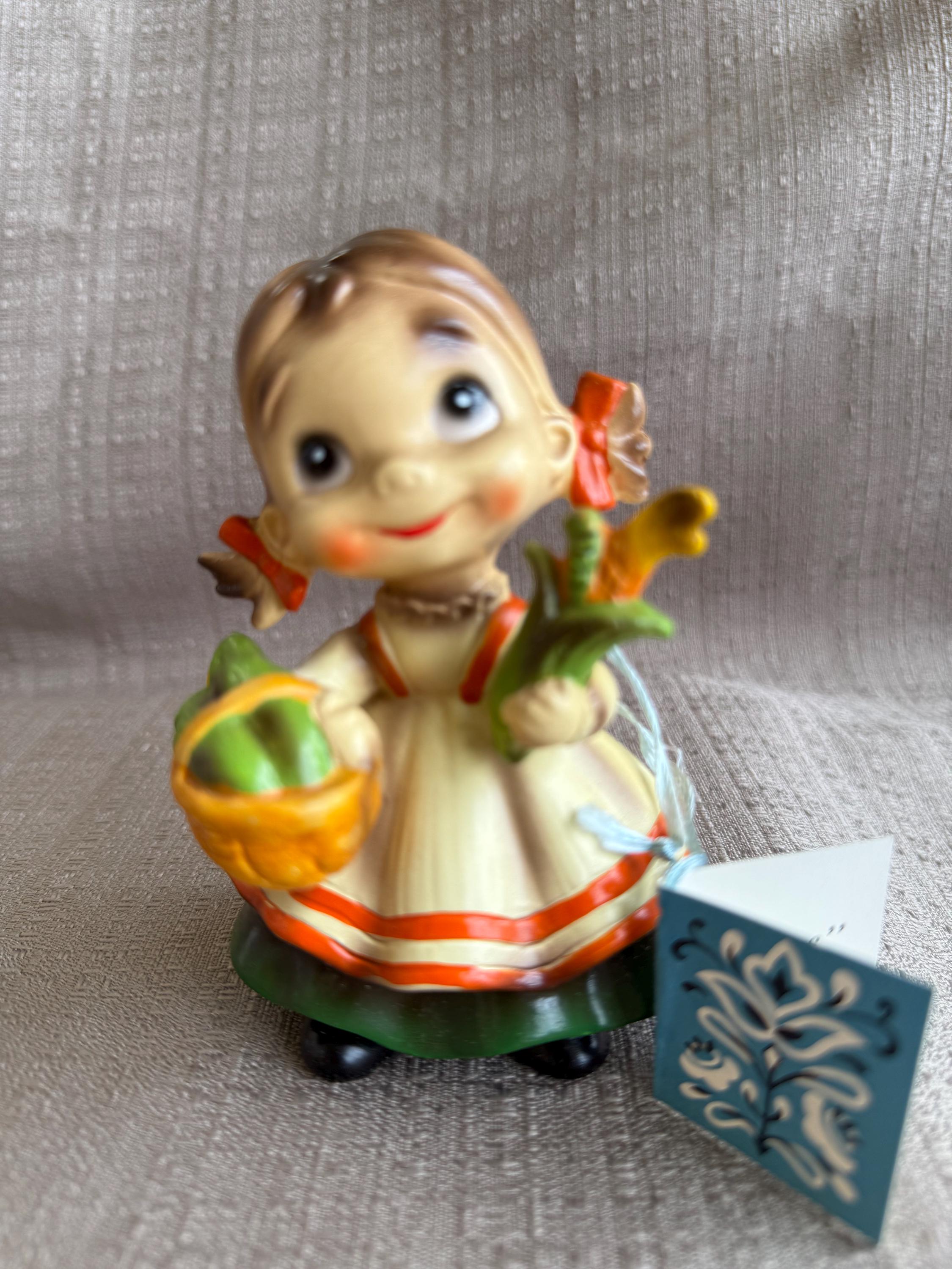 Josef Originals Wee Folks, Girl Holding Corn With Catepillar