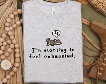 I&#39;m Starting To Feel Exhausted Shirt, Stardew Valley, Funny Cat, Cat Lover, Sleepy Cat, Pixel Art, Gamer Gift, Summer Unisex Tee, Cozy Gamer