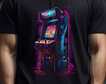 May include: A black t-shirt with a retro arcade game graphic. The game is in a neon pink, blue, and purple color scheme. The graphic is of a classic arcade game with a screen showing a pixelated game scene.