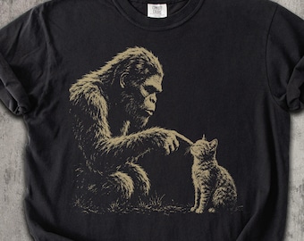 Bigfoot Booping Cat Shirt, Funny Sasquatch Cat Lover Tee, Bigfoot and Kitten Graphic Shirt, Cryptid Lover Gift, Comfort Colors Tee