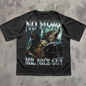 May include: Black t-shirt featuring a graphic of three werewolves howling under a full moon with lightning bolts. The text "NO MORE MR. NICE GUY" is printed above the image in a silver font.