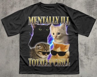 May include: Black t-shirt featuring four cat portraits with sunglasses. The text "MENTALLY ILL" is above the cats, and "TOTALLY CHILL" is below. The design includes lightning bolt graphics.