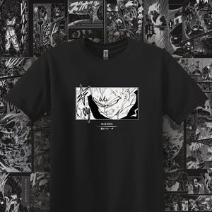 May include: Black t-shirt with a white graphic of a manga character with spiky hair and the text "MAJIK VEGETA" and "成人ヘジーチ".