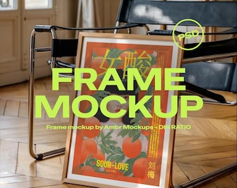 May include: A framed art print mockup with the text "FRAME MOCKUP" in large, green letters. The artwork features a red and orange design with Chinese characters and the words "SOUR-LOVE". The frame is leaning against a chair.