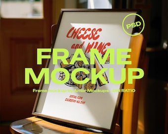 May include: A framed print with the words "CHEESE and WINE" in red, and "FRAME MOCKUP" in green. The print is displayed on a wooden chair. The image also includes the text "SOCIAL CLUB EVERYDAY ALL DAY".