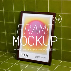 May include: A framed art print mockup with a dark wood frame. The artwork features a gradient of pink, yellow, and orange. The text "FRAME MOCKUP" is displayed prominently, along with the word "BODY" and the phrase "The physical body is a temple. Take care of it."