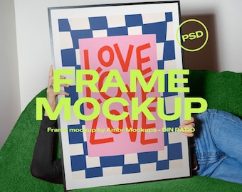 May include: A framed art print mockup with the words "LOVE FRAME MOCKUP" in a bold, neon green font. The artwork features a pink rectangle with the word "LOVE" in red, set against a blue and white checkered background. The frame is held by a person.