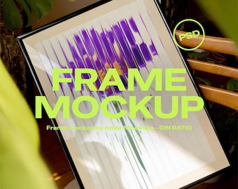 May include: Black framed art print with a floral design in shades of purple and yellow. The words "FRAME MOCKUP" are in large, bright green letters across the front of the frame. The image also includes the text "Photoshop & Photopea (free)".