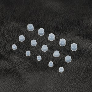May include: Assortment of clear silicone bottle stoppers in various sizes. The stoppers are arranged on a black surface.