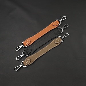 May include: Three leather straps with silver metal clasps. The straps are brown, black, and tan.