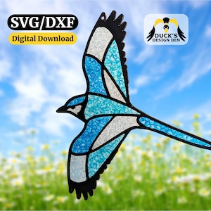 May include: A stained glass design of a blue jay in flight, with blue, white, and black accents. The image includes the text "SVG/DXF Digital Download" and "Duck's Design Den". The background shows a blue sky and flowers.
