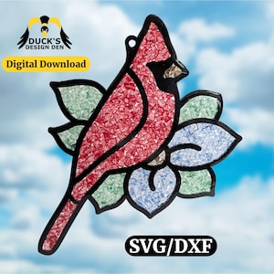 May include: A stained glass cardinal bird design with red, black, green, and blue colors. The bird is perched on a flower with a black outline. The image includes the text "Digital Download" and "SVG/DXF".