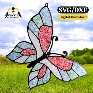 May include: A colorful butterfly-shaped decoration with red, blue, green, and white segments. The design is outlined in black and has a loop for hanging. The image includes the text "SVG/DXF Digital Download."