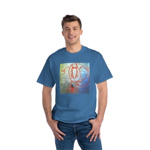 May include: A blue t-shirt featuring a red and white drawing of a monster with a large mouth and a small person standing in front of it.