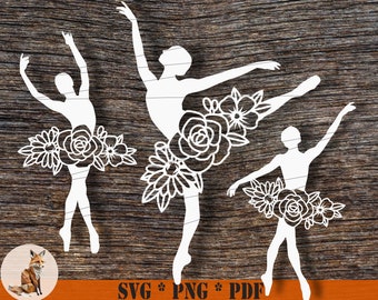 Peut inclure: Trois silhouettes blanches découpées de ballerines avec des motifs floraux sur leurs jupes. Les ballerines sont dans des poses différentes. L'arrière-plan est une texture en bois.