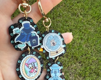 Chaveiro com pingente de bolsa / fantasma de mansão mal-assombrada