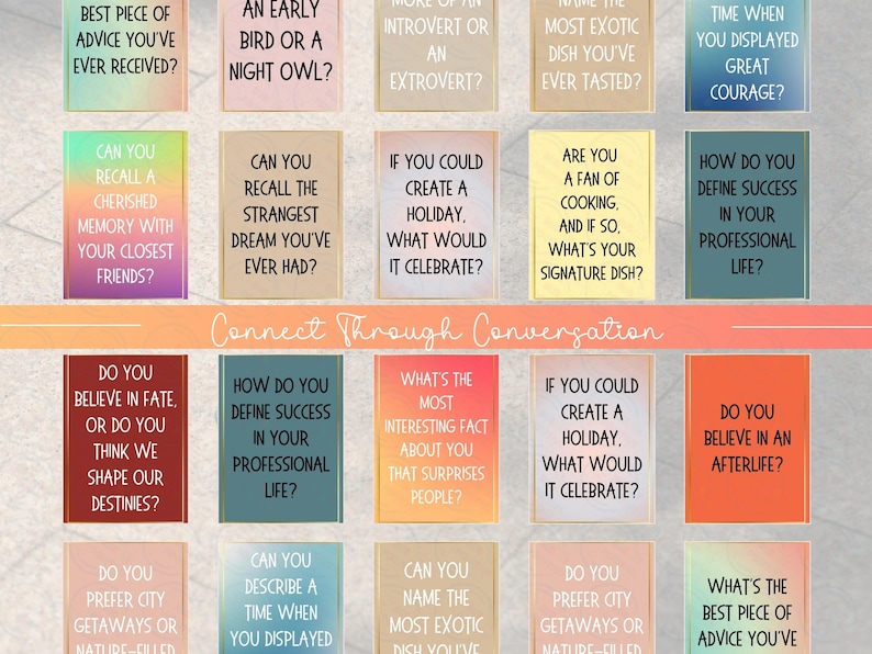 May include: A colorful set of conversation starter cards with questions printed on each card. The cards are arranged in a grid pattern and feature a variety of colors, including red, orange, yellow, green, blue, and purple. The cards are designed to help people connect and learn more about each other.