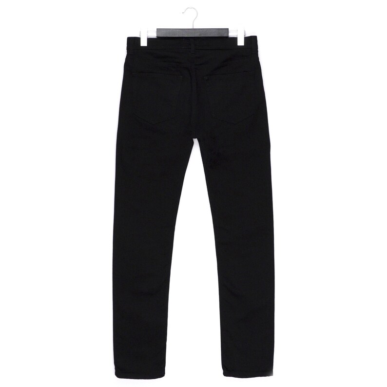May include: A pair of black denim jeans hanging on a white hanger. The jeans have a classic five-pocket design and a straight leg cut. The back pockets are visible, and the fabric appears to be a medium weight.