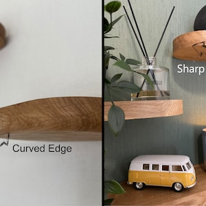 May include: Two wooden floating shelves with curved and sharp edges are displayed. One shelf is mounted on a white wall, the other on a green wall. Decorative items like a candle, a yellow and white toy van, and a diffuser are placed on the shelves.