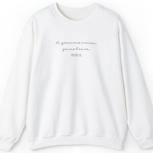 A Gracious Woman Gains Honor Proverbs 11:16 Sweatshirt Black Font
