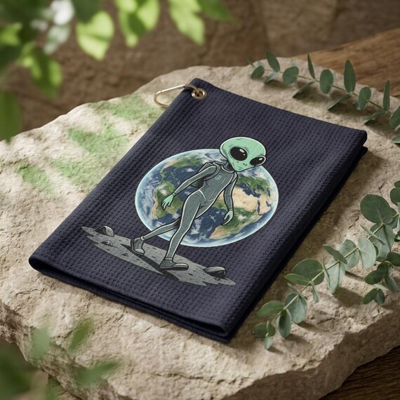 Alien Walking on Moon golf towel | Earth Background