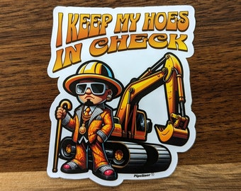 May include: A sticker featuring a cartoon image of a man in a suit, sunglasses, and a hard hat, holding a cane, next to a yellow excavator. The text "I KEEP MY HOES IN CHECK" is printed in orange above the image.