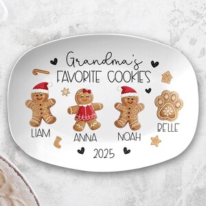 May include: White oval serving platter with the text "Grandma's Favourite Cookies." The platter features gingerbread people with names Liam, Anna, and Noah, plus a paw print with the name Belle. The year 2025 is also displayed.