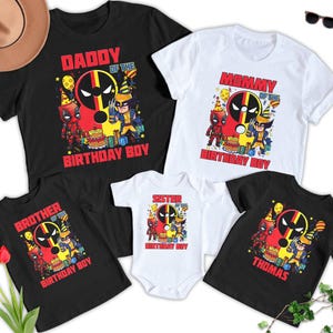May include: Set of five black and white t-shirts featuring a red and yellow graphic of Deadpool and Wolverine. The shirts read "Daddy of the Birthday Boy", "Mommy of the Birthday Boy", "Brother of the Birthday Boy", "Sister of the Birthday Boy", and "Thomas".