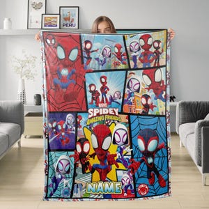 May include: A rectangular blanket featuring a collage of Spider-Man and friends. The design includes various action poses and the text "Marvel Spidey and His Amazing Friends." The blanket is primarily red, blue, and white.