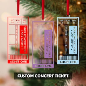 May include: Three clear acrylic custom concert ticket ornaments with red, purple, and blue accents, each with a red ribbon for hanging. The tickets read "Your Concert Here, Any Artist" and "Admit One."