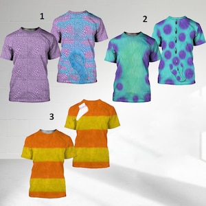 May include: A collection of five short-sleeved t-shirts labeled 1, 2, and 3. The first pair features purple reptile scales and a blue tail design. The second pair displays teal fur with purple spots and a central spine. The third pair has orange and yellow stripes.