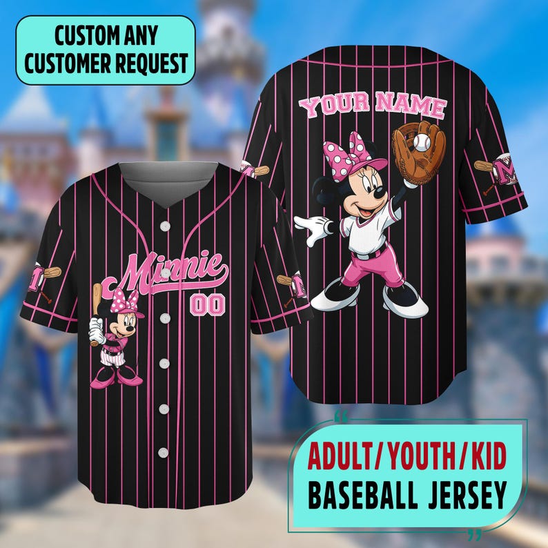 May include: Black baseball jersey with pink pinstripes, featuring Minnie Mouse graphics. The jersey has the text "Minnie" and the number "00". The back of the jersey has the text "YOUR NAME". Available in adult, youth, and kid sizes.