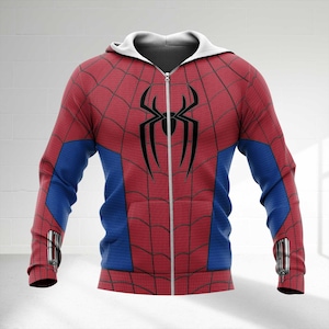 May include: A red and blue zip-up hoodie with a white hood. The hoodie features a black spider emblem on the chest and a web pattern across the red sections. Blue panels are on the sleeves. The hoodie has a full zipper and silver accents.