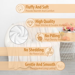 a bed with a white comforter on top of it